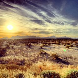 Scenic view of landscape against sky during sunset