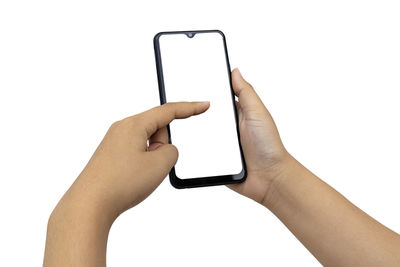 Midsection of man using mobile phone against white background