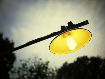 Low angle view of street light against sky