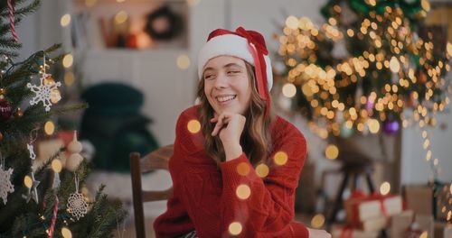 Portrait of smiling young woman standing outdoors