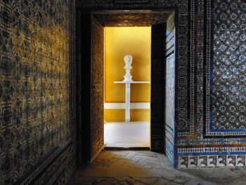 Tiled interior with male bust on yellow background seville andalusia spain