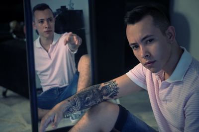 Multiple image of handsome young man sitting at home