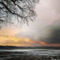 Scenic view of sea against cloudy sky