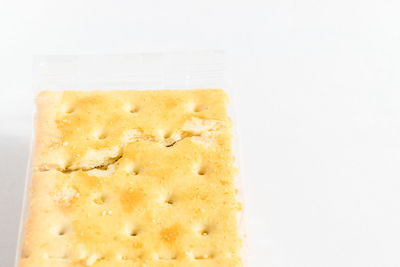 Close-up of bread against white background