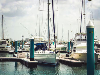 Boats moored at harbor