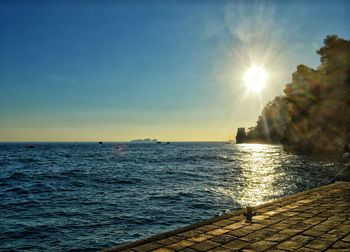 Scenic view of sea against sky at sunset