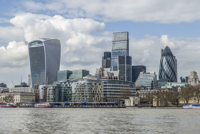 Modern buildings in city against sky