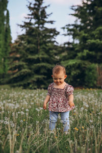 Full length of girl standing on field