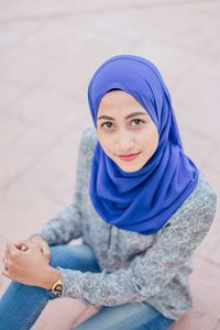 Portrait of woman sitting outdoors