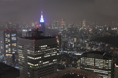 Illuminated buildings in city at night