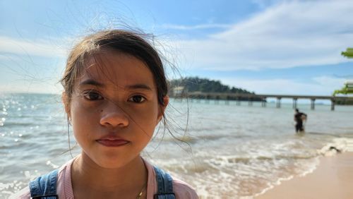 Portrait of young woman at beach