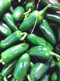 Full frame shot of green chili peppers for sale