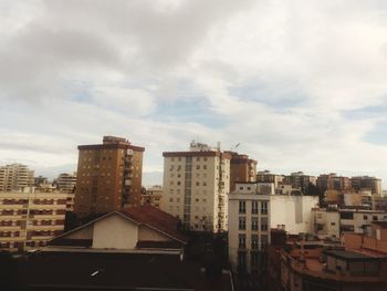 High angle view of buildings in city against sky