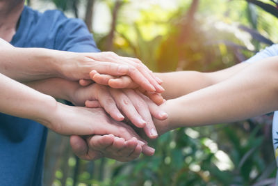 Close-up of people hands against blurred background