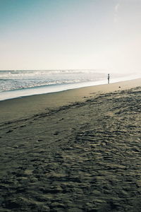 Scenic view of beach against clear sky