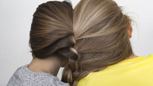 Rear view of women with braided hair