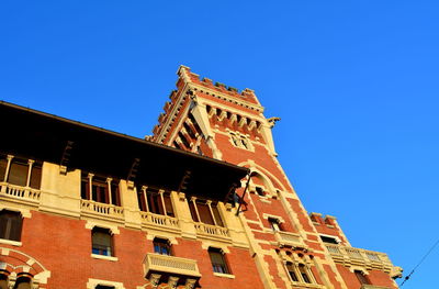 Low angle view of building against blue sky