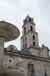 Low angle view of statue of building against sky