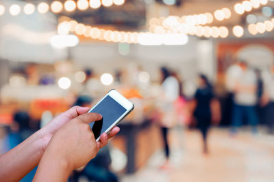 Close-up of woman using mobile phone