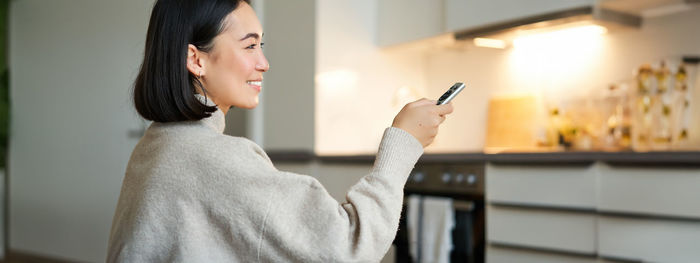 Young woman using mobile phone