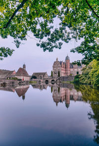 Reflection of castle hämelschenburg in lake