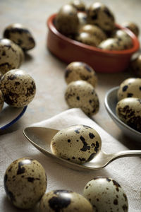 Quail eggs on a stone table.