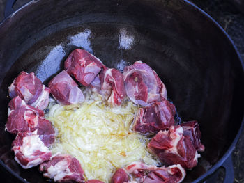 High angle view of meat in cooking pan