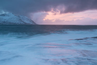 Scenic view of sea against sky at sunset