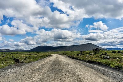 Road amidst land against sky - roadtrip to hverfjall crater - iceland