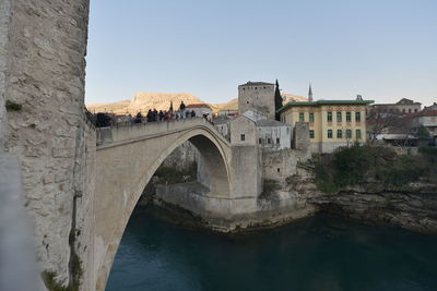 Bridge over river against clear sky