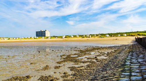 View of beach against sky in city