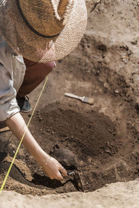 High angle view of woman working on field