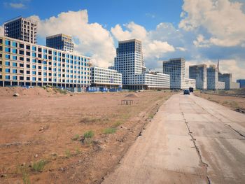 Buildings in city against sky