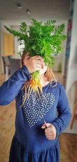 Midsection of woman holding umbrella