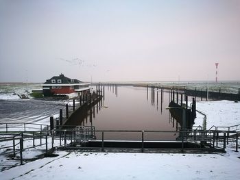 Scenic view of frozen lake against clear sky