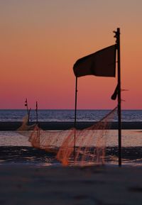 Scenic view of sea against clear sky during sunset