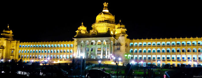 Low angle view of illuminated building at night