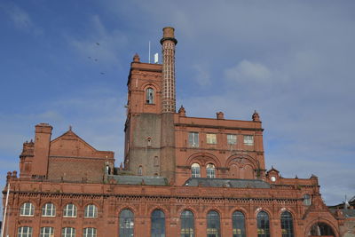 Low angle view of old building against sky