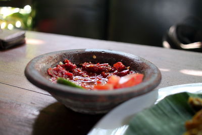 High angle view of food called sambal or chilli source in plate on table