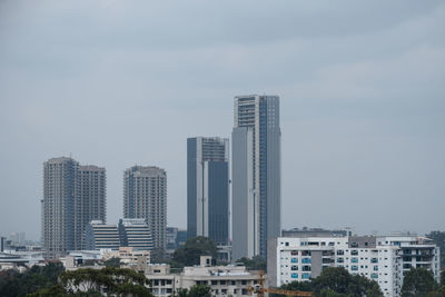 Modern buildings in city against sky