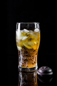 Close-up of drink against black background