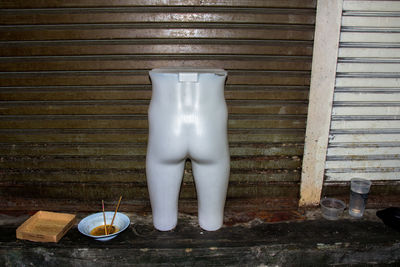 Glass of white wine on wooden table