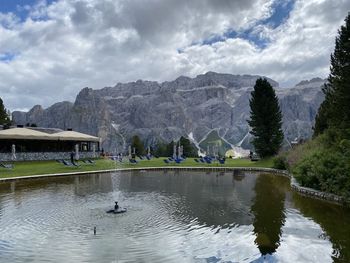 Scenic view of lake and mountains against sky