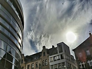 Low angle view of building against cloudy sky