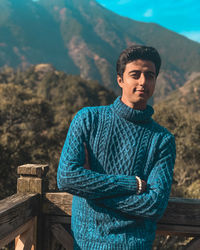 Portrait of young man standing outdoors