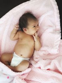 High angle view of cute baby sleeping