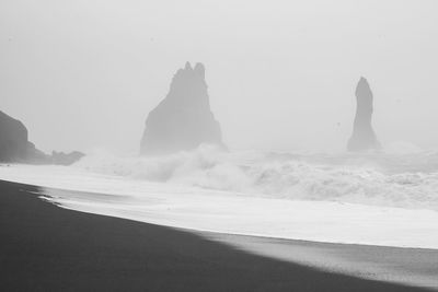 Spicky cliffs on stormy day monochrome landscape photo