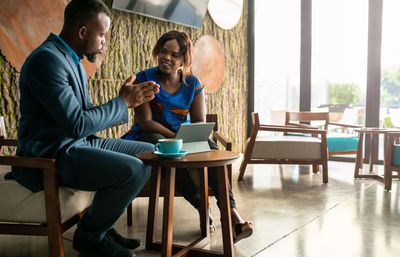 People sitting on table at home