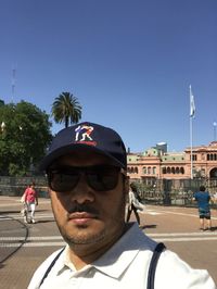 Portrait of man in sunglasses against clear sky