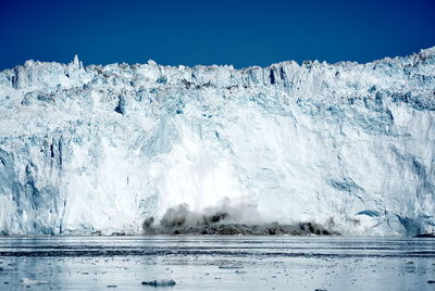 Scenic view of frozen sea against sky